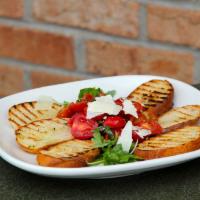 Bruschetta Classic · Toasted campagnola bread served with fresh Roma tomatoes, basil, extra virgin olive oil, and...