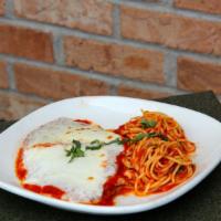 Chicken Parmesan · Hand-breaded chicken breast baked with marinara sauce and mozzarella cheese. Served with spa...