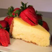 Cheesecake · Topped with a fresh strawberry sauce on a homemade graham cracker crust.