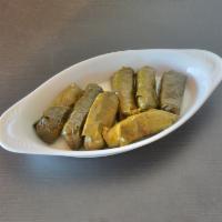 Veggie Dolmeh (7 Pieces) · Filling of rice, herbs, and meat stuffed in grape leaves