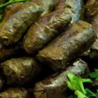 Meat Dolmeh (7 Pieces) · Filling of rice, ground beef, herbs, and meat stuffed in grape leaves