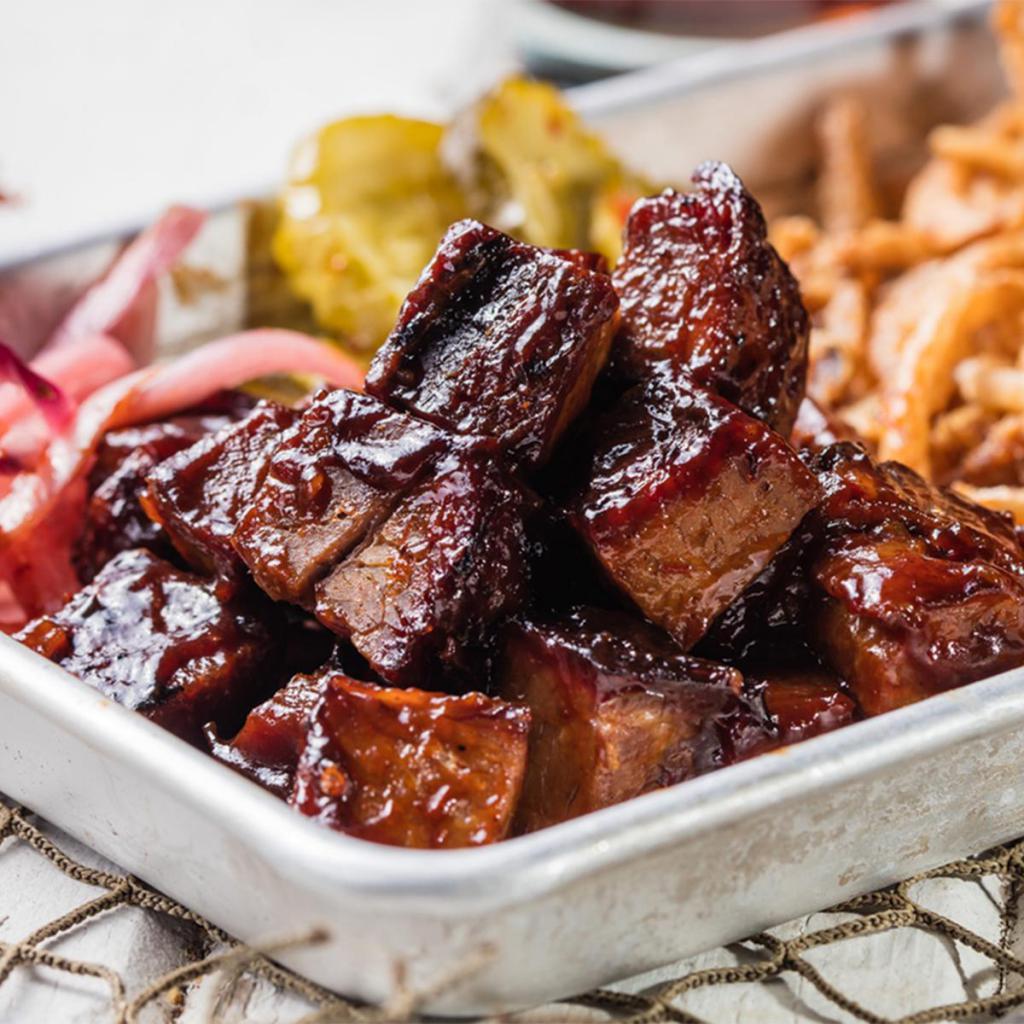 Burnt Ends (Appetizer) · Tender pieces of Texas beef brisket seared and caramelized with Sweet and Zesty BBQ sauce.