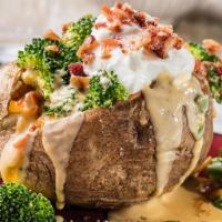 Brocoli & Cheese Baked Potato  · Served with one side and topped with tender, fresh broccoli, cheddar cheese sauce, bacon, so...