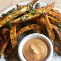 Baked Sweet Potato Fries · Spiced and baked sweet potato with coconut oil and love. Served with cashew tomato fry sauce...