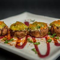 Baked Stuffed Mushrooms · Baby Bella stuffed with Thai cashew cream, spinach, and scallion, on a
blueberry vinaigrette...