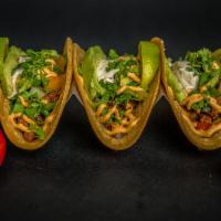 Bison Tacos · Organic corn tortilla filled with sautéed bison, bell pepper, onion. Topped with
romaine let...