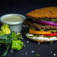 Falafel Burger · Crunchy almond, sunflower seed falafel burger with hummus, parsley, onion,
tomato, pickle, a...