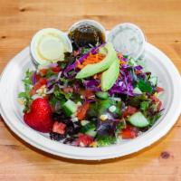 Garden Salad · Fresh greens, tomato, cucumber, squash, avocado, red onion, red cabbage, shredded carrots, a...