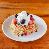Berry Good Pancakes · Berry mascarpone, raspberry coulis, vanilla creme anglaise, fresh berries and whipped cream.