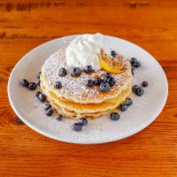 Lemon Berry Pancakes · Lemon custard, fresh blueberries and whipped cream.