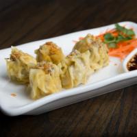 A2 Steamed Dumplings (4 pcs) · Steamed minced shrimp and chicken wrapped in wonton skin topped with fried garlic. Served wi...