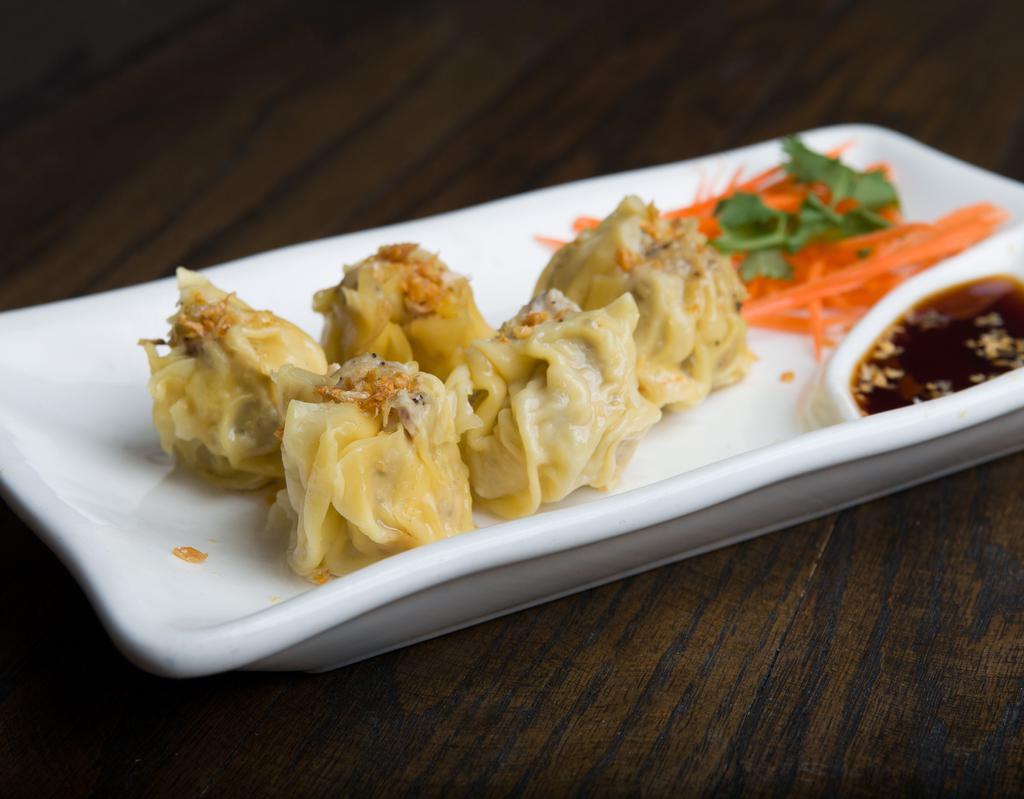 A2 Steamed Dumplings (4 pcs) · Steamed minced shrimp and chicken wrapped in wonton skin topped with fried garlic. Served with sweet soy sauce.
