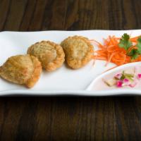 A8 Curry Puff (3 pcs) · Deep fried puff pastry stuffed with ground chicken, sweet potato, onion, and curry powder.