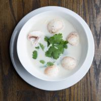SP2 Tom Kha Soup · Coconut based soup with mushrooms seasoned with aromatic galangal, lime juice, and cilantro
