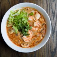 N3. Tom Yum Noodles Soup · Thin rice noodles with choice of chicken or shrimp in tom yum broth, coconut milk, mushroom,...