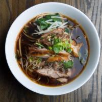 N4. Duck Noodles Soup · Thin rice noodles in dark broth, Chinese broccoli, bean sprout, celery, scallion, cilantro, ...