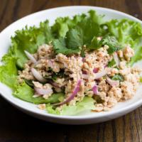 S3. Larb Gai Salad · Minced chicken, red onion, mint, toasted rice powder, chili powder, cilantro, and lettuce wi...