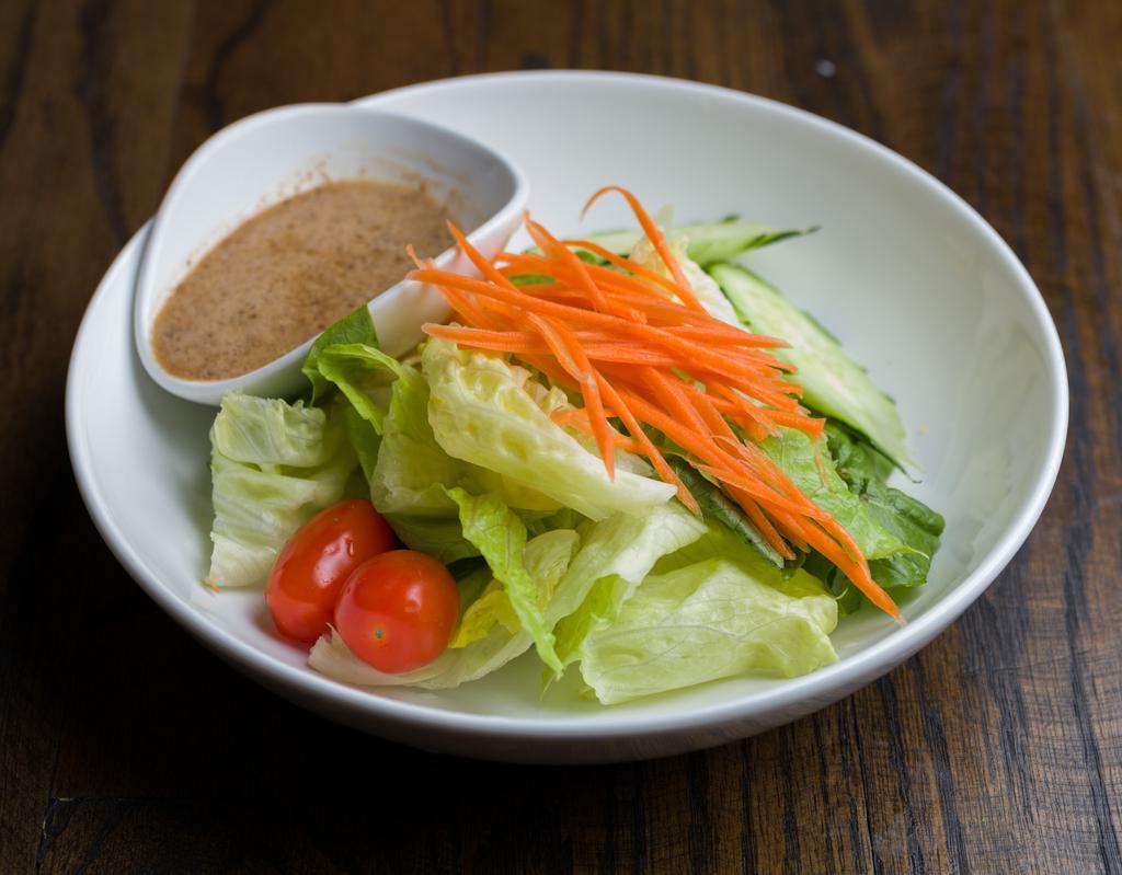 S8. Green Salad · Lettuce, carrot, tomato, and cucumber with sesame dressing.