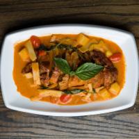 D1. Duck Curry · Red curry sauce, bamboo shoot, pineapple, tomato, basil, and bell pepper. Served with rice. ...