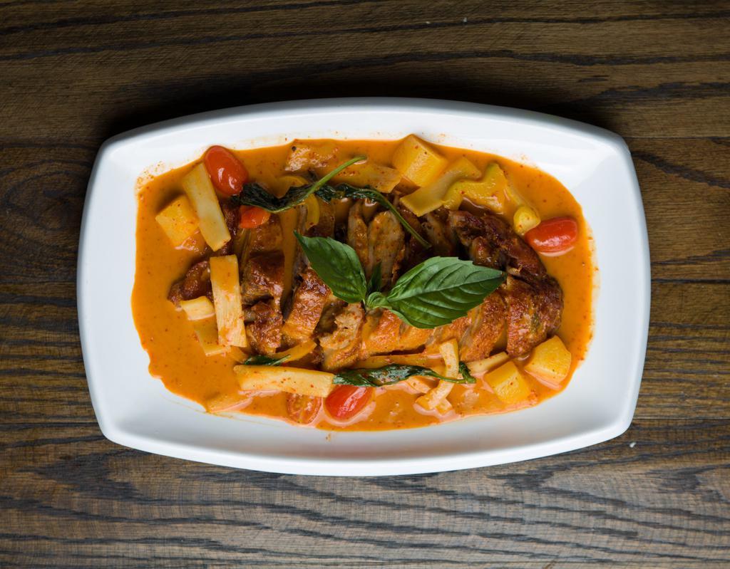 D1. Duck Curry · Red curry sauce, bamboo shoot, pineapple, tomato, basil, and bell pepper. Served with rice. Spicy