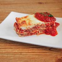 Meat Lasagna · Layers of lasagna filled with our seasoned ground meat, ricotta cheese and Greek feta, toppe...