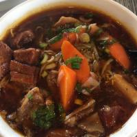 9. Beef Stew Noodle Soup · Savory light broth with noodles. 
