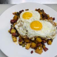 Corned Beef Hash and Eggs · Home potatoes, onions, peppers and 2 sunny side up eggs.