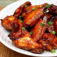 6 Chicken Wings Niramish Style · Chicken party wings marinated in special tandoori sauce, grilled in clay tandoori oven and t...