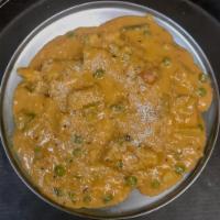 Korma · Mildly spiced dish with turmeric, fresh chopped garlic and ginger in a thick creamy sauce. S...