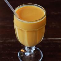 Mango Lassi · Cool and refreshing homemade smoothie with mango and fresh yogurt.