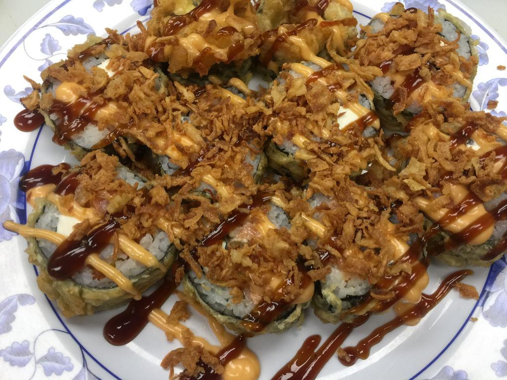 Vegas Roll (10 pcs) · Rice, seaweed, cream cheese, salmon, fried shrimp, avocado, spicy sauce, sushi sauce, fried onion, tempura batter.