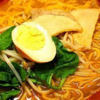 Miso Ramen · Slow cooked miso broth with chashu simmered pork, bean sprout, spinach, boiled egg, green on...