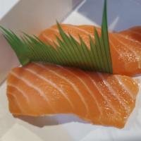 Salmon sushi nigiri 2pcs · Sushi laid top of rice.
