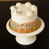 White Confetti cake with white buttercream and sprinkles · 6
