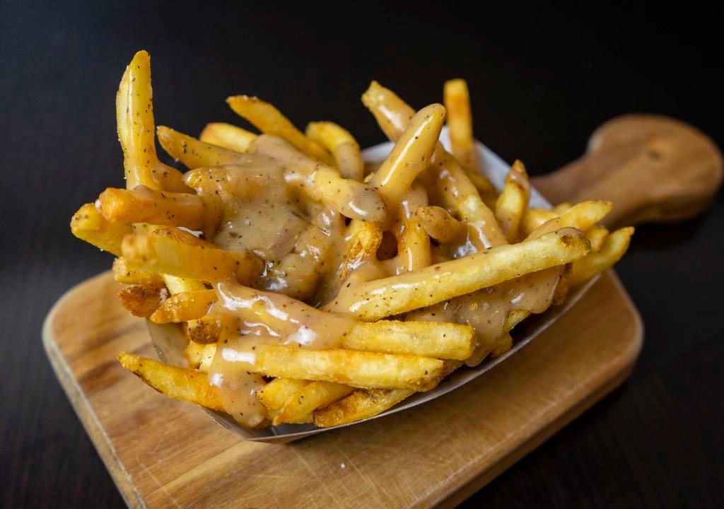 Gravy Fries · Fries covered with house-made gravy, made with chicken, beef & pork.