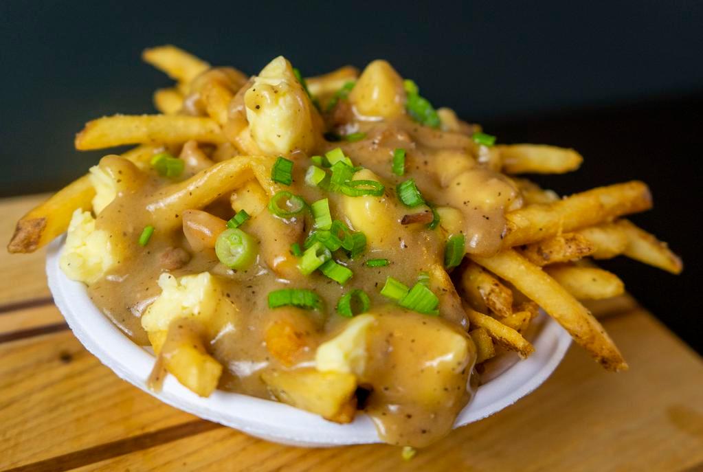 Poutine · fries topped with Wainright Dairy Fresh Cheddar Curds, Housemade Gravy, Scallions