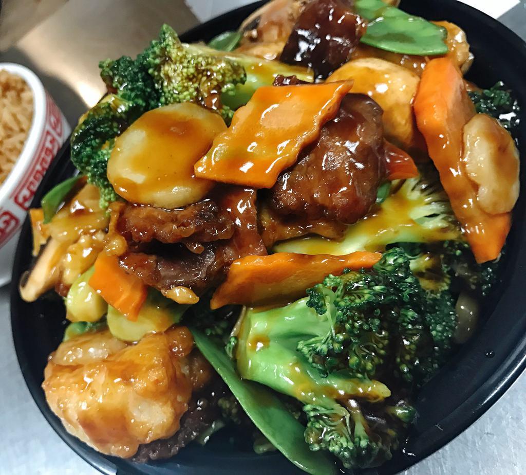 Triple Delight · Jumbo shrimp, white meat chicken and tender beef sauteed with broccoli, baby corn, mushroom and other vegetables in special brown sauce. Served with white rice.