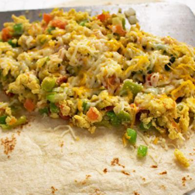 #10 (Vegetarian) · Egg, bell pepper, onion, tomato, chopped green chile and cheese. Veggie. 580 calories.