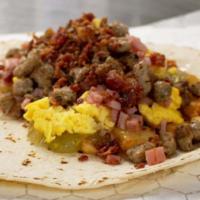 #12 (Three Meat Biggie) · Sausage, bacon, ham, egg, potatoes, green chile and cheese. 910 calories.