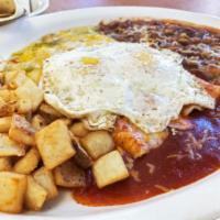 (Enchilada Rancheros) · Comes with 2 cheese enchiladas. Served with pan fried potatoes, slow cooked pinto beans, 2 e...