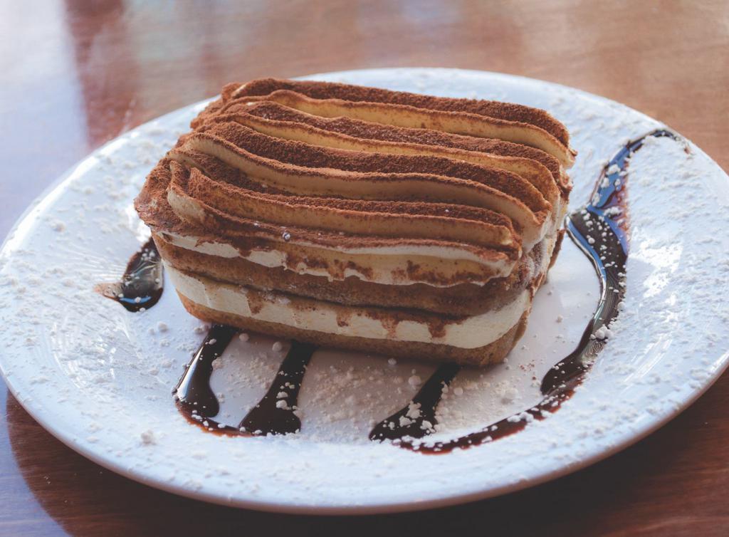 Tiramisu · An Italian dessert made with mascarpone, espresso-soaked ladyfingers, whipped cream and a dash of cocoa.