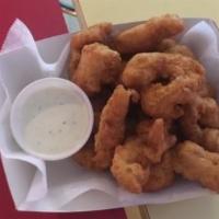 Beer Battered Chicken Strips · Thin strips of chicken breast coated in beer batter and fried golden brown. Served with hone...
