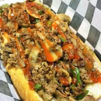 Philly Cheesesteak Sandwich · Prime beef chopped with grilled onions and bell peppers, mayo, served on a fresh hoagie roll.