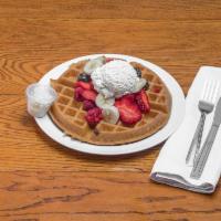 *#100. Belgian Waffle - Special · Topped with berries, banana and whipped cream. Served with 2 eggs, sausage patty, home fries...