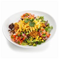Taco Salad · A blend of seitan taco meat, lettuce, cabbage, salsa fresca, roasted corn, green onions, cil...