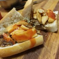 Cheese Steak Hot Sandwich with the Works · Peppers, onions, potatoes, and ketchup.