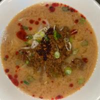 Dan Dan Ramen · Miso-based beef bone broth with peanut sauce. Topped with bean sprouts, ground pork, hot oil...