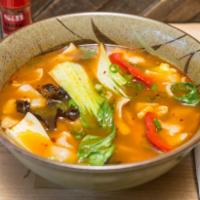 T3. Then-Thuk · Traditional Tibetan hand-pulled flat noodle soup with shredded chicken, bell peppers, mushro...