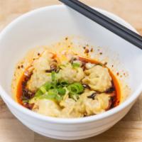 A6. Wonton with Red Oil · Home made pork wonton dumpling in red oil sauce with scallions.