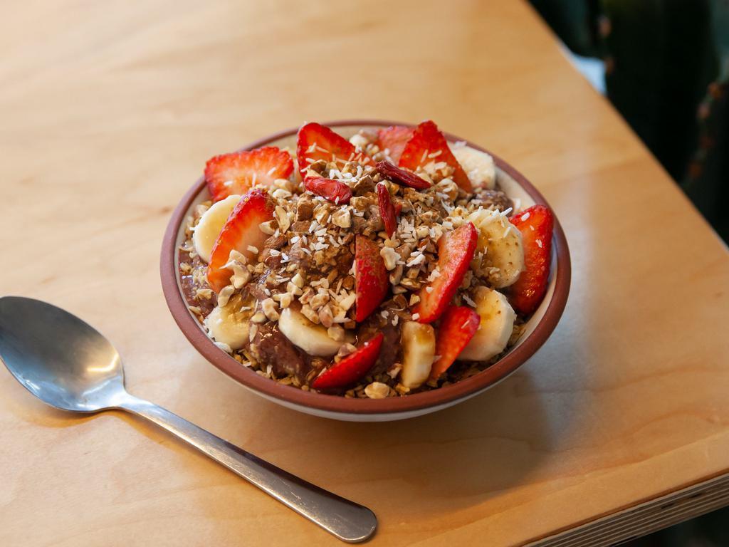 Small Bowl of The Gods · Peanut butter, acai, banana, strawberries, vanilla lucuma protein, hemp milk, crushed almonds, goji berries, coconut flakes, Grizzlie's granola, cinnamon and maple syrup drizzle. No Substitutions. 